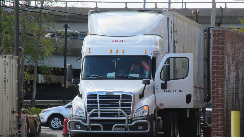 A Freightliner Cascadia pulling a McLane trailer