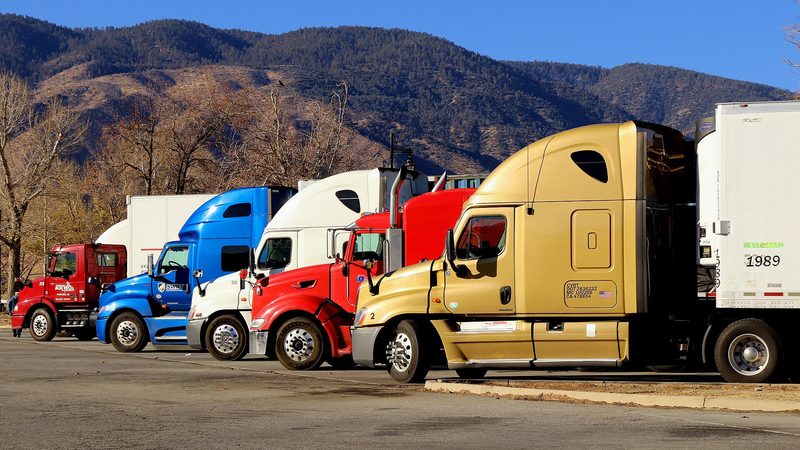 Colorful semi trucks, the cabs whose dashes a phone mount has to clear