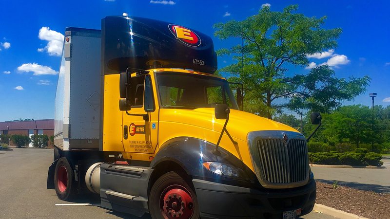 Trucks lined up in a lot, the first week a new driver is walking into