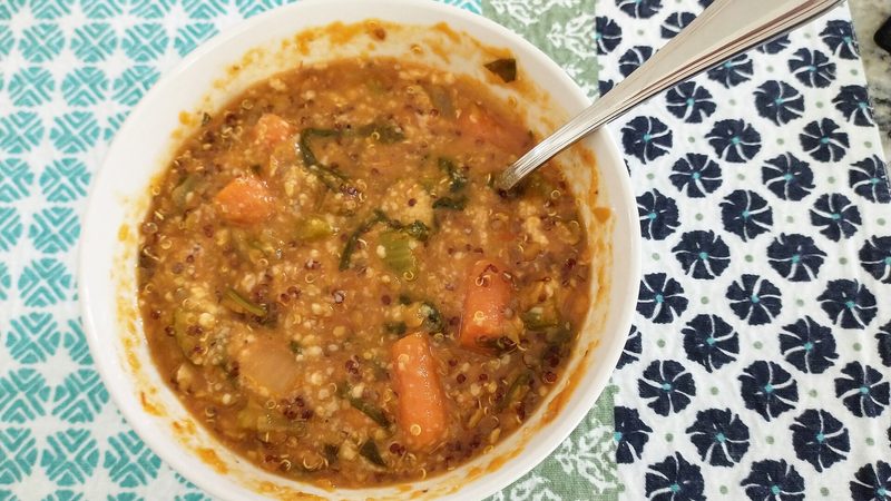 A bowl of lentil soup with green and red lentils