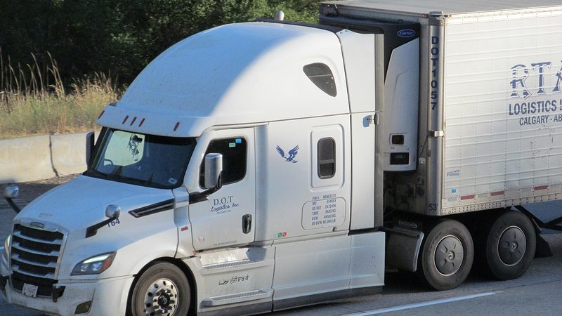 A Freightliner with a refrigerated trailer on I-90 near Spokane