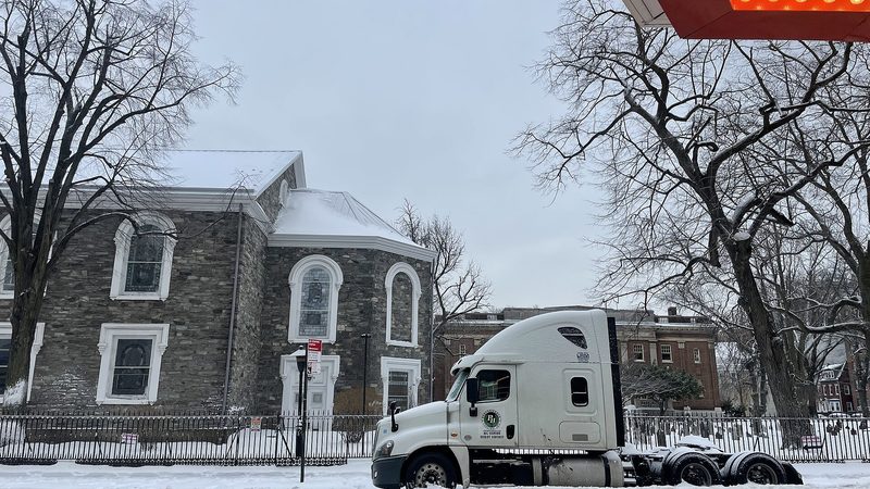 A semi truck parked in the snow